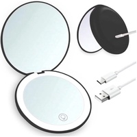 Double-sided makeup mirror with 10x magnifying LED lighting and adjustable brightness. Small, illuminated mirror with adjustable intensity, ideal for 