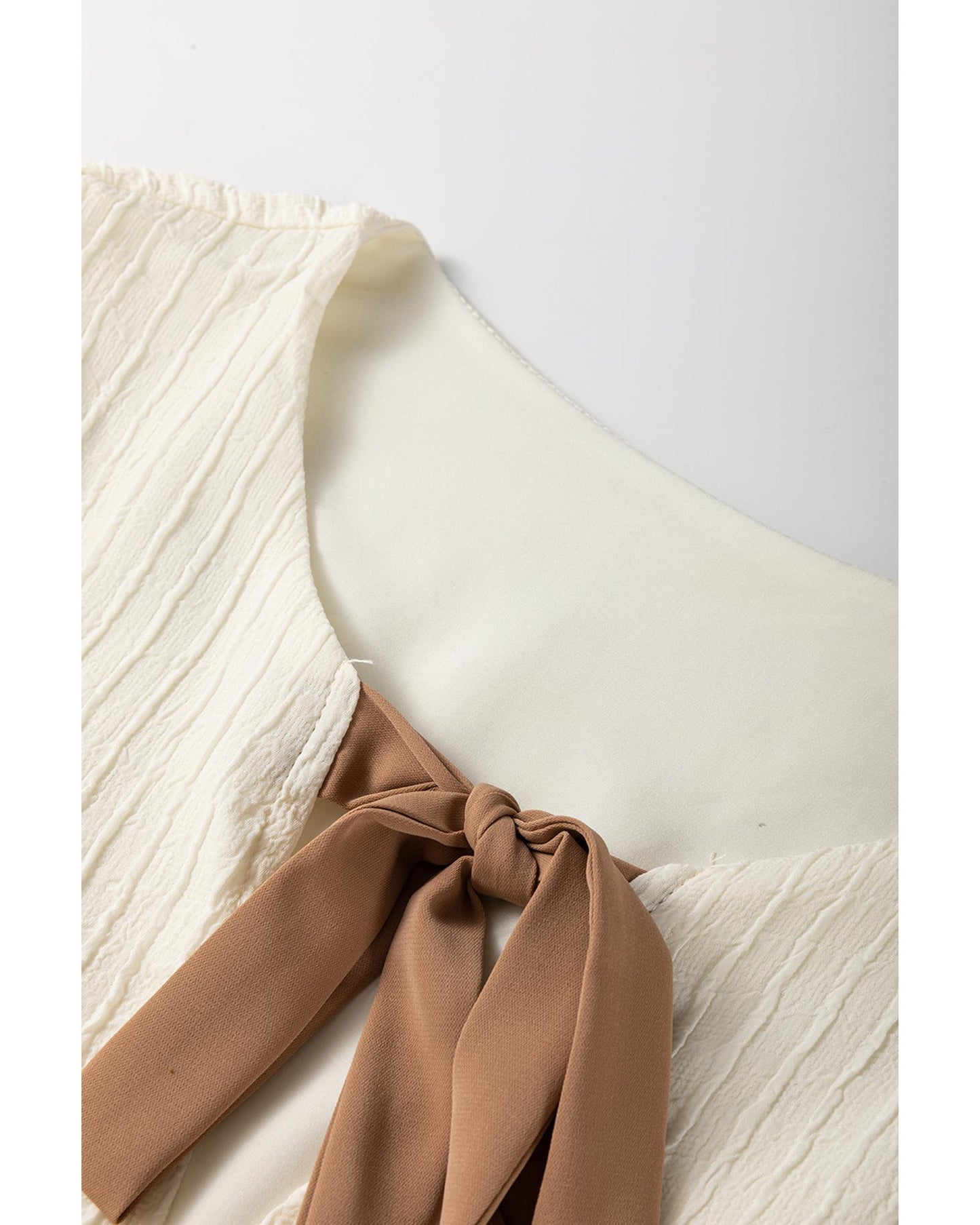 White Textured Bow Ties Front Bubble Hem Puff Short Sleeve Blouse - L